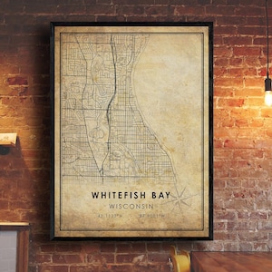 May include: A vintage-style map print of Whitefish Bay, Wisconsin. The map is in black and white and has a beige background. The text "Whitefish Bay, Wisconsin" is printed at the bottom of the map, along with the coordinates "43.1133°N 87.9001°W".
