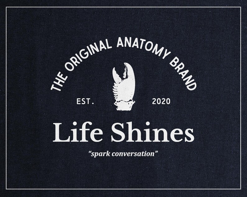 a black shirt with the words life shines printed on it