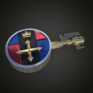 May include: A gold key with a round, multi-colored head. The head features a black background with a gold crown, a gold arrow pointing up, and gold arrows pointing left and right. The head is surrounded by a silver ring.