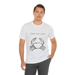 May include: A white t-shirt with a black and white illustration of a crab and the text "TIME FOR CRAB".