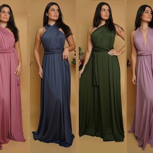 Peut inclure: Quatre femmes portant des robes infinies de diff&eacute;rentes couleurs. Les robes sont faites d'un tissu doux et extensible et peuvent &ecirc;tre styl&eacute;es de nombreuses fa&ccedil;ons. Les robes sont disponibles en rose, bleu, vert et violet.