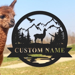 May include: Black metal silhouette of a llama standing in front of a mountain range with a river and trees. The silhouette is surrounded by a circle with the text "CUSTOM NAME" on a banner below.