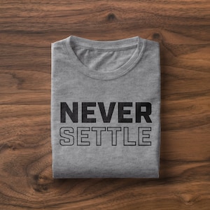 May include: A gray t-shirt with the text "NEVER SETTLE" printed in black.