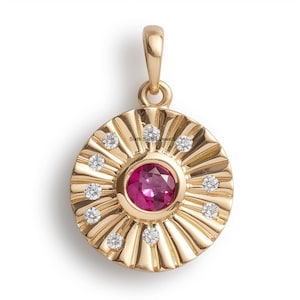 May include: A gold pendant with a pink gemstone surrounded by smaller white gemstones. The pendant is in the shape of a sun with rays.