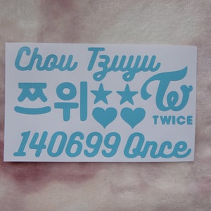 May include: A white sticker sheet with light blue text and graphics. The text includes the name "Chou TzuYu", Korean characters, stars, hearts, the word "TWICE", and the numbers "140699 Once".