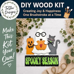 May include: DIY wood kit featuring Halloween-themed wooden cutouts of a jack-o'-lantern, ghost, and cat. The ghost holds a pumpkin with a heart. The sign reads "Spooky Season" in green letters. The kit includes the text "Make This Kit Your Own!"