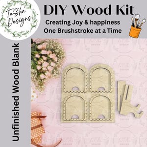 May include: A DIY wood kit with the text "Creating Joy & happiness One Brushstroke at a Time." The kit includes an unfinished wood blank with four arched openings and a stand. The design features a floral wreath and a paint brush holder.