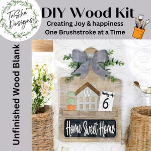 May include: DIY wood kit for creating a home sweet home sign. The kit includes a wooden cutting board with a house shape, a chalkboard sign, a bow, and a party of 6 sign. The kit is unfinished and ready to be painted.