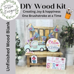 May include: DIY wood craft kit featuring a blue truck with a flower market sign, a round wooden sign that says "Bloom Where You Are Planted", a banner with the word "Bloom", and a sign that says "hello spring".