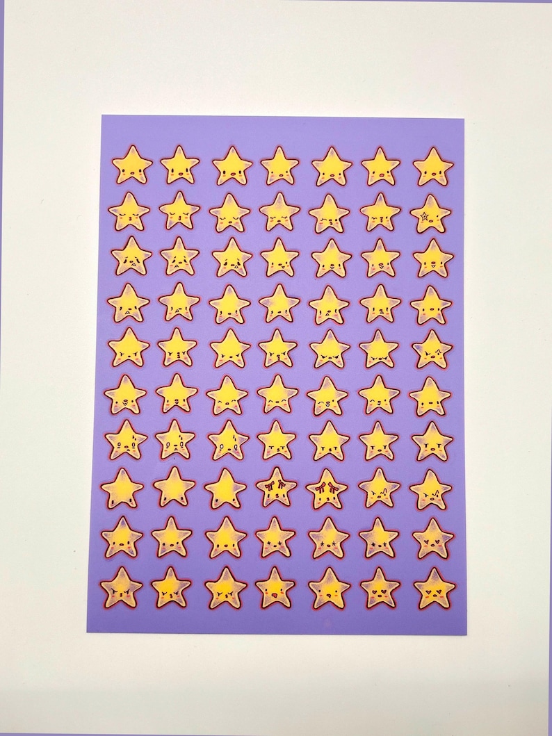 May include: A sheet of stickers featuring yellow cartoon stars with smiling faces and red outlines. The stars are arranged in a grid pattern on a purple background. The stickers are on a white background.