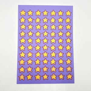 May include: A sheet of stickers with a purple background and numerous yellow star shapes with red outlines. The stars are evenly spaced across the sheet, creating a repeating pattern. The stickers are likely for crafts or decoration.