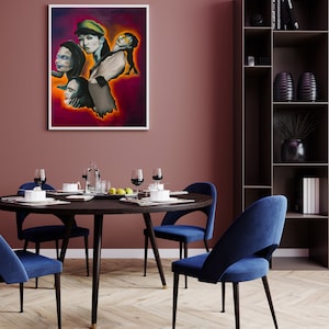 May include: A round dining table with four blue velvet chairs. The table has a dark wood top and black legs. A framed painting of four women with colorful backgrounds hangs on the wall behind the table.