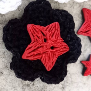 Button as star red black with structure in the surface, for sewing image 4