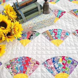 Cheerful vintage generational yellow and white fan quilt