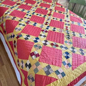 Wonderful 1880s cinnamon pink and calico/chrome yellow Quilt in a Jacobs ladder variation