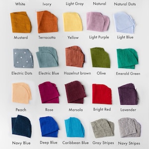 May include: A chart of 20 fabric swatches in various colors and patterns, including white, ivory, light gray, natural, natural dots, mustard, terracotta, yellow, light purple, light blue, electric dots, electric blue, hazelnut brown, olive, emerald green, peach, rose, marsala, bright red, lavender, navy blue, deep blue, caribbean blue, gray stripes, navy stripes, black, and dusty pink.