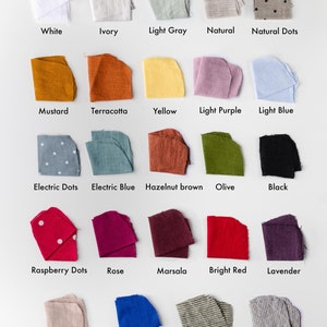 May include: A collection of fabric swatches in various colors and patterns, including white, ivory, light gray, natural, natural dots, mustard, terracotta, yellow, light purple, light blue, electric dots, electric blue, hazelnut brown, olive, black, raspberry dots, rose, marsala, bright red, lavender, dusty pink, deep blue, gray stripes, and navy stripes.
