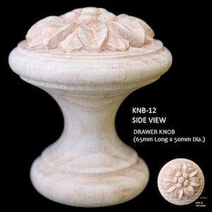 May include: A wooden drawer knob with a carved flower design. The knob is 65mm long and 50mm in diameter. KNB-12 Side View.