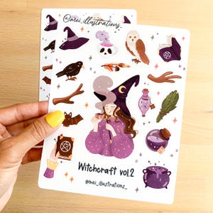 May include: Two sticker sheets featuring illustrations of witchcraft-themed elements. The stickers include a witch with a purple outfit and hat, a crow, an owl, a cauldron, potion bottles, and the text "Witchcraft vol.2".