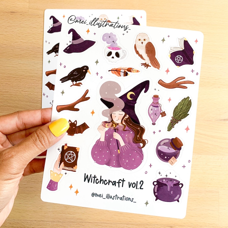 May include: Two sticker sheets featuring illustrations of witchcraft-themed elements. The stickers include a witch with a purple outfit and hat, a crow, an owl, a cauldron, potion bottles, and the text "Witchcraft vol.2".