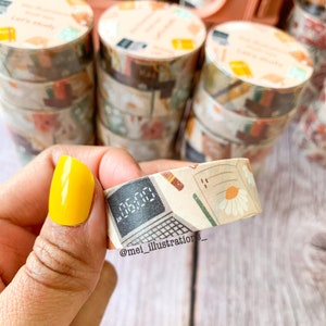 May include: Decorative washi tape rolls with a beige background and a variety of designs, including a computer screen displaying "06:00", daisies, and stationery. The rolls are stacked, and the text "Let's study" is visible on some.