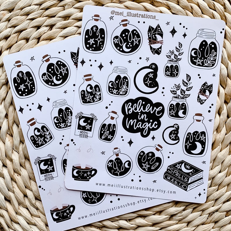 May include: Two sheets of white stickers featuring black and white illustrations of potion bottles, moons, stars, crystals, and the phrase "Believe in Magic." The stickers have a whimsical, celestial theme.