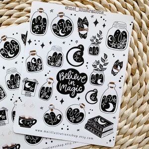 May include: Two sheets of stickers with a witchy theme. The stickers feature black and white illustrations of potion bottles, crystals, moons, stars, plants, a coffee cup, and a spell book. The phrase "Believe in Magic" is also included.