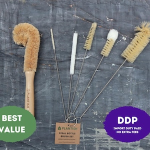 May include: A set of five bottle brushes with a wooden handle brush and four thin metal wire brushes with various bristle types. A brown paper tag is attached to the metal brushes with the text PLANTISH SISAL BOTTLE BRUSH SET.