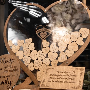 This Heart-Shaped Wedding Guest Book Alternative Features Rustic Wood, Custom Engraving, and Sweet Drop-in Heart Tokens