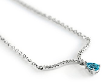 Collar único de diamantes de oro en forma de V con colgante de topacio azul colgante