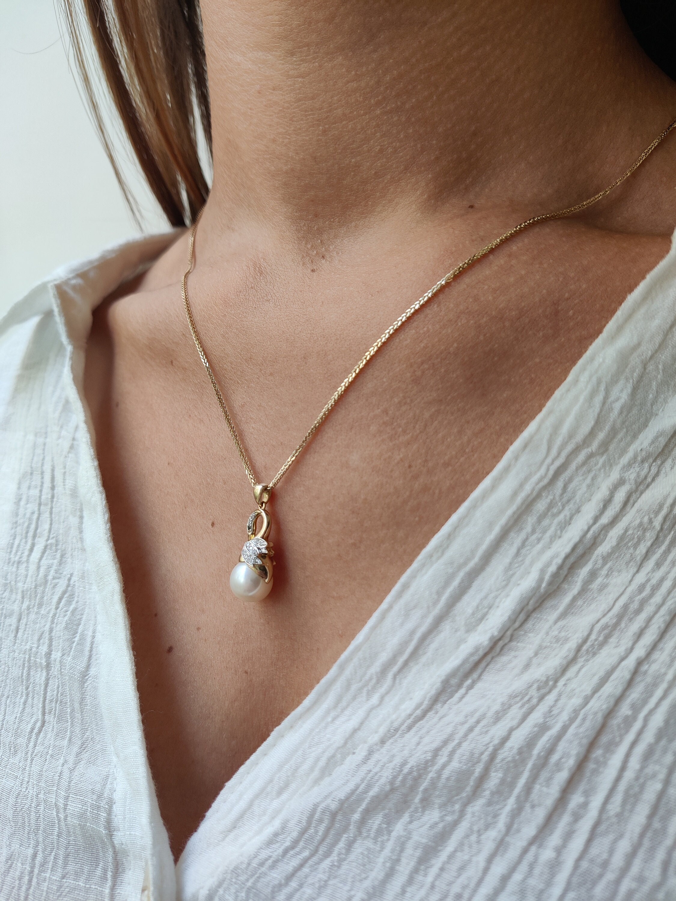 Swan Pearl Necklace with White Diamonds and Black Diamonds Embedded In The Swan's Eyes