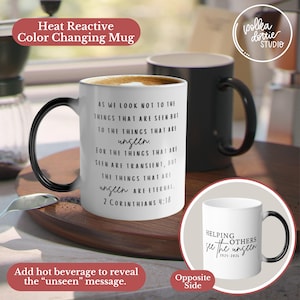 May include: A white heat-reactive color-changing mug with a black handle. The mug features the text "AS WE LOOK NOT TO THE THINGS THAT ARE SEEN BUT TO THE THINGS THAT ARE unseen... 2 Corinthians 4:18". The opposite side says "Helping others see the unseen 2025-2024".