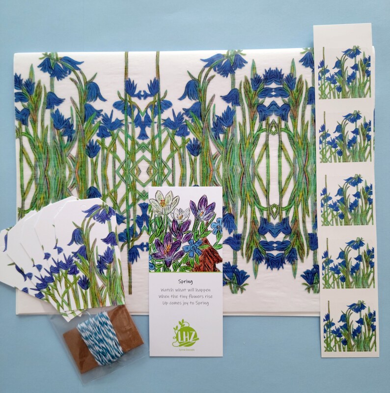 Shown above: all the components of the kit: the tissue paper, gift tags, small spool of twine, stickers, and bookmark. There is enough paper to wrap several small size gift boxes or a couple of medium sized and large gift boxes.