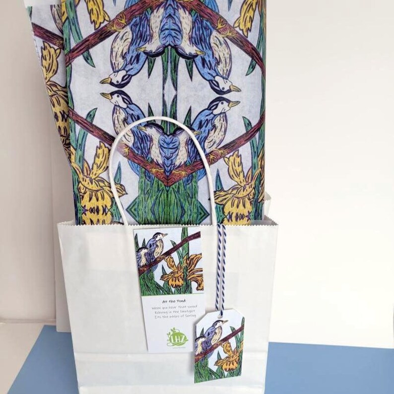 The tissue paper also makes an excellent gift bag liner. Shown above: the paper used in a simple white gift bag. The gift tag and bookmark hang from the center edge of the bag.