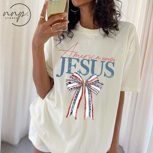 Chemise Comfort Colors® America Needs Jesus Coquette Bow 4 juillet, sweat-shirt 4 juillet, chemise patriotique, drapeau américain, fête de l'indépendance