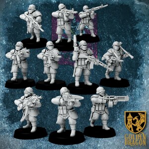 May include: A collection of miniature figurines of soldiers in combat gear, each holding a weapon. The figures are in a light gray color and stand on black bases. The Golden Dragon logo is in the bottom right corner.