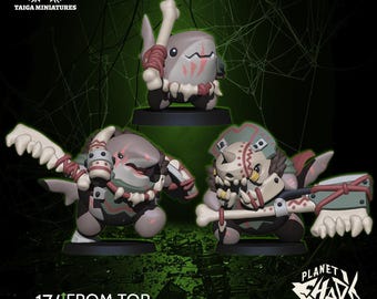 May include: Three miniature figurines of shark-like creatures with bone and red accents. The figurines are on black bases. The text on the image reads "17/ FROM TOP 30mm TO BOTTOM" and "PLANET SHARK". The Taiga Miniatures logo is in the top left corner.