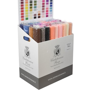 May include: A white cardboard display box filled with multiple rolls of colourful crepe paper. The box features the Cartotecnica Rossi logo, the text "Superior Florist Crepe Paper 180 g", and a colour reference chart attached to the back panel.