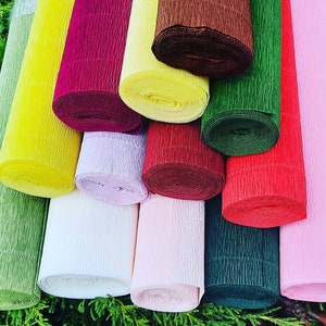Italian crepe paper rolls with original labels in soft pastel colors including dusty rose, light blue and sage green