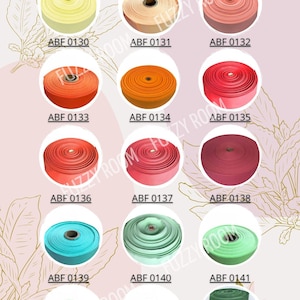 K&ouml;nnte beinhalten: Farbpalette mit Spulen aus B&auml;ndern in verschiedenen Farben, darunter Gelb, Orange, Rot, Rosa, T&uuml;rkis, Gr&uuml;n und Burgunder. Jede Spule ist mit einem eindeutigen Code versehen. Das Wort "Palette" steht oben.