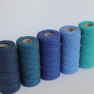 Stack of 4mm cotton macrame cord in yellow, grey and green tones, eco-friendly knitted yarn for handmade crafts and decor