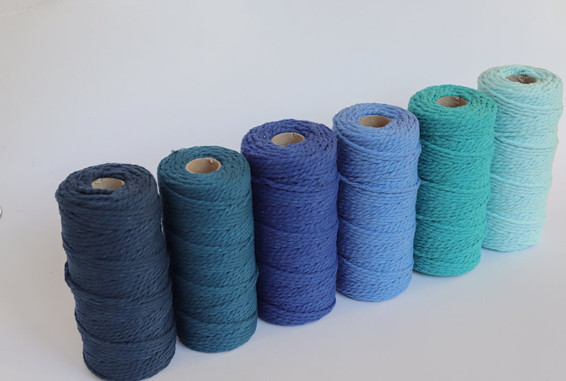 Stack of 4mm cotton macrame cord in yellow, grey and green tones, eco-friendly knitted yarn for handmade crafts and decor