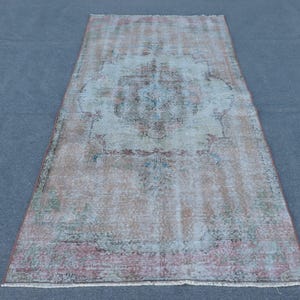 May include: A set of three ceramic mugs with a speckled, matte finish in cream, light grey, and dark grey. Each mug has a simple, minimalist design, ideal for coffee or tea.