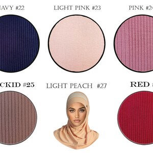 May include: Six fabric swatches in different colors, including navy, light pink, pink, orchid, light peach, and red. Each swatch is a close-up of a ribbed fabric.