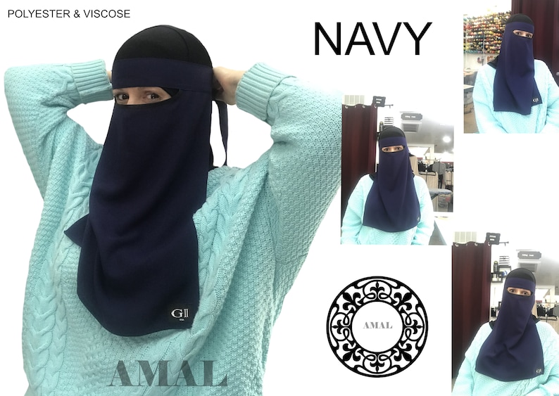 May include: A navy blue niqab with a face opening and a long, flowing back panel. The niqab is made of polyester and viscose and has the word "AMAL" printed on the bottom. The image also shows the niqab being worn by a person.