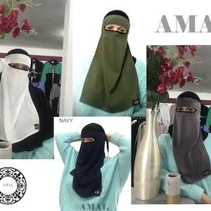 May include: Four different colored niqabs with a black under-cap. The niqabs are in the colors white, green, gray, and navy blue. The niqabs are made of a soft, breathable fabric. The niqabs are all the same style, with a long, flowing piece of fabric that covers the head and neck, and a smaller piece of fabric that covers the face. The niqabs are all available in a variety of colors.