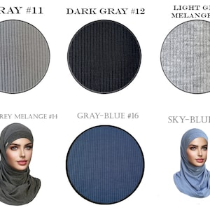 May include: Six fabric swatches in different shades of gray and blue. The swatches are labeled with their color and number. The swatches are arranged in two rows of three. The top row shows gray, dark gray, and light gray. The bottom row shows dark gray melange, gray-blue, and sky-blue.