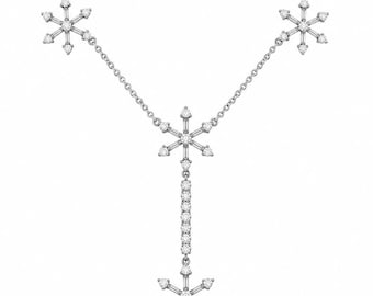 May include: A silver-toned necklace featuring a delicate chain with three snowflake-shaped pendants adorned with small clear stones. A vertical drop section extends from the center snowflake, ending in a fourth snowflake pendant at the bottom.