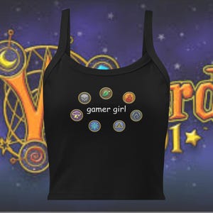May include: Black crop top with a white graphic of various symbols and the text "gamer girl".