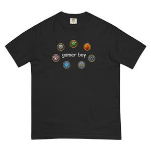 May include: Black t-shirt with the text "gamer boy" and eight colorful circular graphics. The graphics include a skull, leaf, flame, lightning bolt, snowflake, triangle, and two other symbols.
